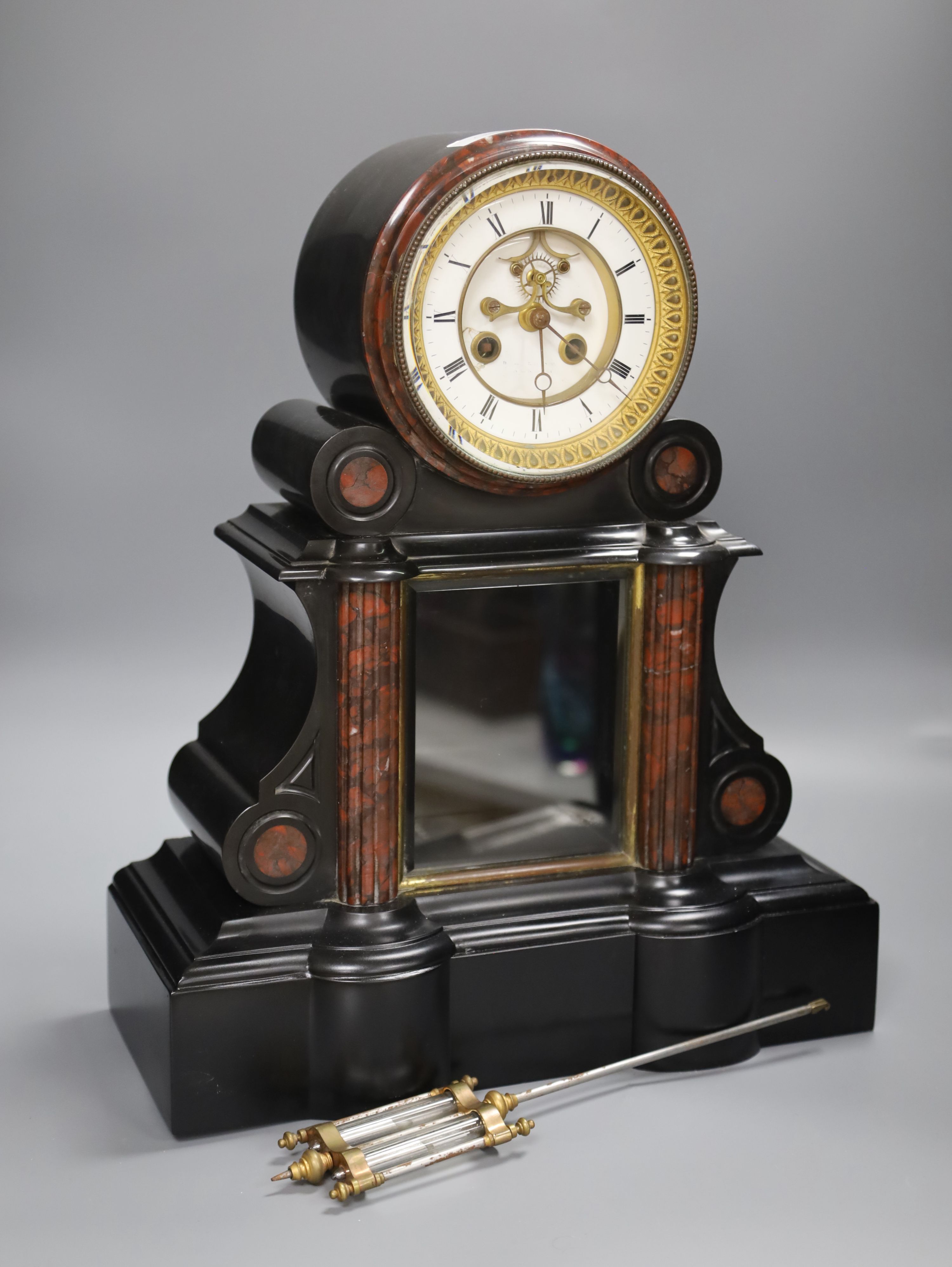 A Victorian black slate and rouge marble mantel clock, height 46cm